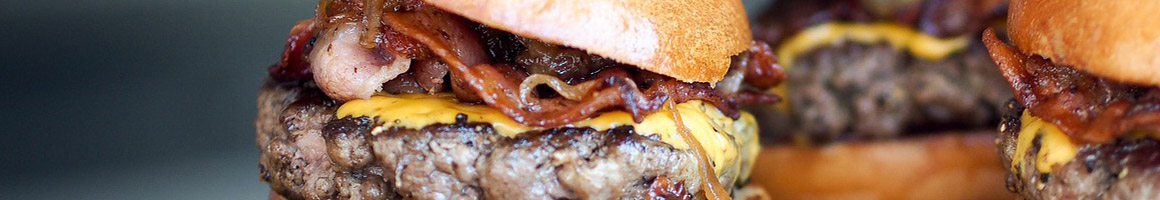 Eating Burger at Jaxx Burgers restaurant in Paris, TX.